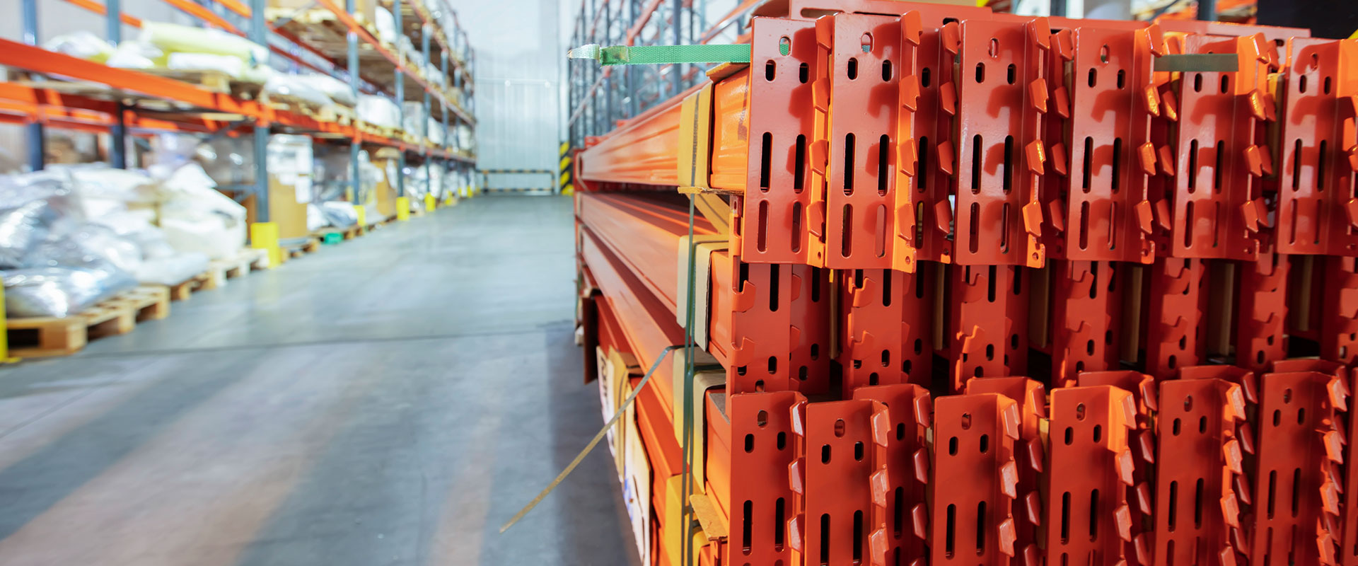 Image of racking being dismantled and piled high.